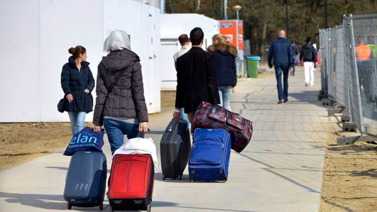 Refugiados con maletas